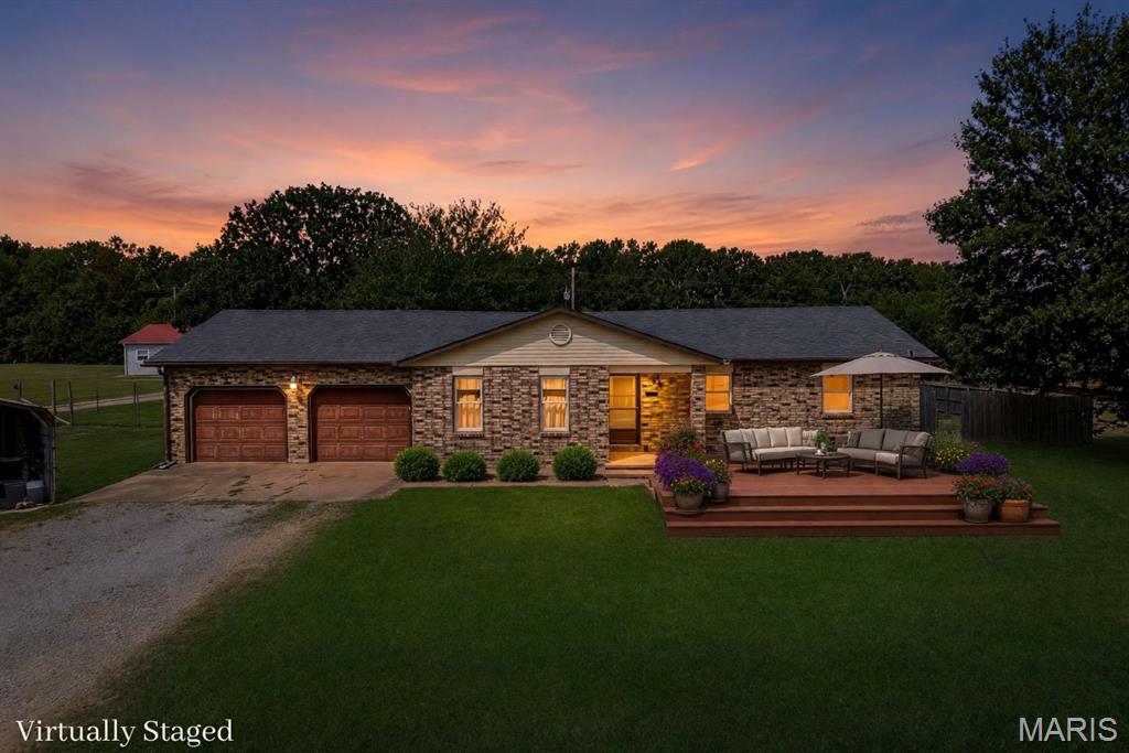 Enjoy the freedom of country living without giving up everyday convenience! Situated on 1.9 acres just off BB & Highway 5, this  1,600sqft home offers a peaceful setting only 10 minutes from Lebanon & 20 minutes from Camdenton. Located on a quiet dead-end street, the property features 3 beds, 2 baths, hard-surface flooring throughout, and plenty of space both inside & out. With no HOA & no restrictions, you’ll have the flexibility to make the property your own. The large, fenced backyard provides a place for children & pets to play while offering plenty of room for gardening, outdoor entertaining, or even adding the swimming pool.  An attached 2-car garage provides convenient parking and additional storage, while the separate carport adds even more versatility. Equipped with a 50-amp electrical hookup & water connection, the carport is ideal for a camper, additional vehicles, or a future workshop area. With nearly two acres, generous parking, a fenced yard, and a location that offers easy access to Hwy 5, this property delivers the space and flexibility that can be difficult to find. Bring your pets, park your recreational vehicles, and enjoy fewer limitations, this one is for you!