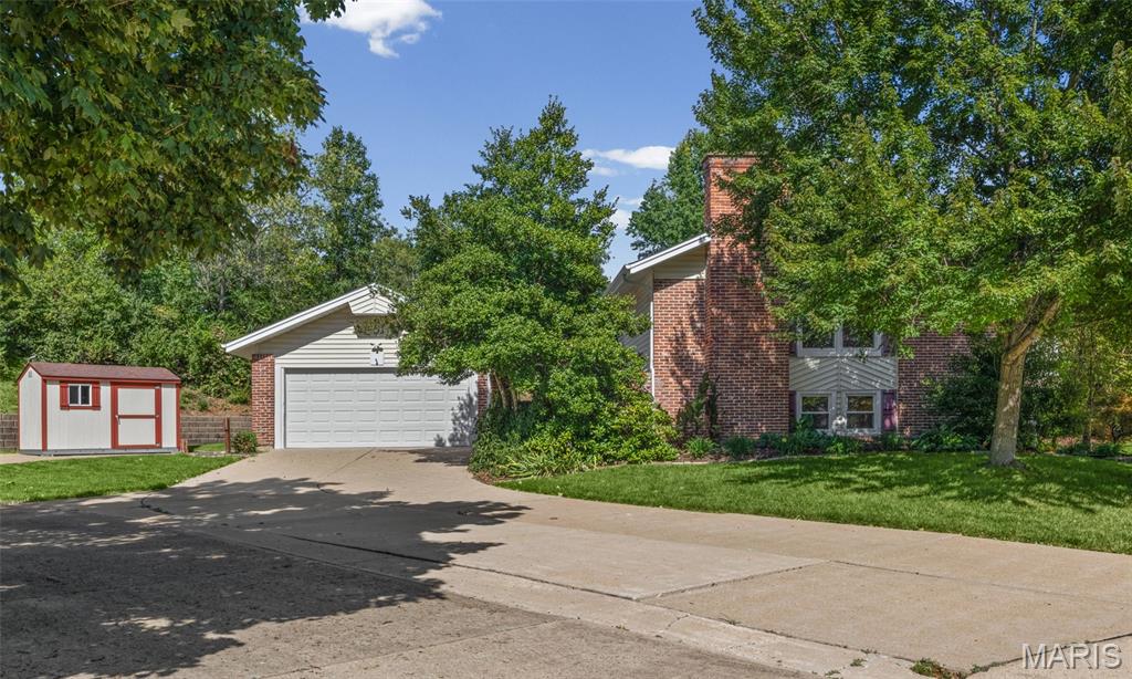 ACTIVE FRIDAY / OPEN HOUSE SUNDAY 9/20:  Welcome to this beautifully updated 4-bedroom, 3-bathroom split-foyer home nestled on a quiet cul-de-sac in the desirable Chapparal Park neighborhood! Boasting ~2,558 square feet of total living space, this home offers a WHOLE-HOUSE STANDBY GENERATOR for peace of mind, abundant natural light, and classic hardwood floors throughout the main level.

The main floor features an open living room with fireplace with high ceilings and a formal dining area, alongside a bright eat-in kitchen with stainless steel appliances and a sliding glass door that opens directly to the back deck. The spacious primary bedroom suite includes an updated private full bath, and customized walk-in closet.  Two additional bedrooms and a second full hall bathroom finish the first spacious level.

The finished lower level expands your living options with a large family room centered around a cozy fireplace and custom bookcase, a forth bedroom (ideal for a private home office), a third full bathroom, and a massive bonus room perfect for a home gym, playroom, or hobby area. You'll also find a dedicated workshop area, laundry, and plenty of extra storage.

Step outside to enjoy the quietness a cul-de-sac offers—with expansive lawn space, mature landscaping, TWO STURDY STORAGE SHEDS, and a covered courtyard area. Complete with a 2-car oversized attached garage, with lots of back and overhead storage and under ground irrigation system to keep your lawn green.
Located in the top-rated Parkway C-2 School District (Sorrento Springs Elem., Southwest Middle, Parkway South High) with quick access to Manchester Park and shopping!