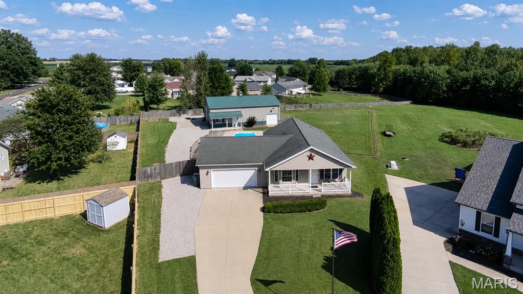 HOME + POOL + .75 ACRE + 30x50 MACHINE SHED

Quiet space to live. Open space to entertain. Impressive space to work.

Set on a .75-acre cul-de-sac lot in Lebanon, 9928 Aldantay Court brings together a beautifully maintained ranch, in-ground pool, expansive fenced yard, flexible finished lower level, pass-through attached garage and an impressive 30x50 machine shed with an additional 10x30 bump-out. The setting offers the breathing room of country living with the convenience of a neighborhood, plus easy access to Scott Air Force Base, Lebanon and surrounding Metro East communities.

Inside, an open floor plan connects the kitchen, dining and living areas with a comfortable flow for everyday life and entertaining. A large island anchors the spacious kitchen, while expanded cabinetry and counter space continue into the dining area, creating a butler's-pantry-style serving, prep and storage area. Motorized blinds in the kitchen and living room, fresh paint and thoughtful improvements add convenience throughout the main living spaces. The oversized primary suite offers generous space, dual closets and direct access to the backyard, pool and garage through a private patio door. 

With a west-facing front and east-facing backyard, the outdoor spaces are especially enjoyable later in the day. The large fenced yard surrounds the in-ground pool while leaving plenty of additional space for grilling, entertaining, recreation or simply enjoying an evening outside as the moon rises and reflects in the pool.

MORE ROOM TO LIVE
The finished lower level expands the possibilities with a newly added third bedroom suite, with full bath, an inviting family room and an area with potential for a second kitchen near the wet bar. The layout provides flexibility for multigenerational living, extended-stay guests, a private home office or additional living space. The family room creates a comfortable second gathering area, and the basement carpeting features an upgraded 8-lb pad and is approximately four years old.

POOL + OUTDOOR LIVING
The in-ground pool anchors a backyard designed to be enjoyed. A custom Latham pool cover purchased in 2025 and a 2025 Dolphin robotic pool cleaner are included. The attached garage adds another practical advantage with overhead doors at both the front and rear, allowing direct access through the garage to the backyard. Hot and cold water hose connections add convenience for vehicles, projects, pool days and outdoor maintenance.

THE MACHINE SHED
For buyers looking for substantial workshop, vehicle or equipment space, the machine shed is a major part of what sets this property apart.
30x50 building
Additional 10x30 bump-out
Concrete floors
10x14 overhead door
Separate entry door for ventilation
220V power
Eight 8-foot LED lights
Two-stage 80-gallon air compressor included
Additional private space outside the building provides parking and storage possibilities for multiple trailers, trucks, cars, boats and recreational equipment.
For contractors, machinists, car enthusiasts, woodworkers, boat or RV owners and serious hobbyists, the property offers the infrastructure and room to put that space to work.

THOUGHTFUL DETAILS BEHIND THE SCENES
The home was constructed with 2x6 exterior walls filled with foam insulation and includes a Liberty Jet water-powered sump pump backup system designed to operate during a power outage or primary-pump failure. Individual water shutoffs at the exterior hose bibs add another practical detail. RV hookup available along with RV clearance door entry at outbuilding. A property with room for everyday living, summer afternoons around the pool, showcase vehicles, equipment, projects and the hobbies that deserve more than a corner of the garage. Convenient to Lebanon, surrounding Metro East communities and Scott Air Force Base.
So much more to this space- this is a must see property!