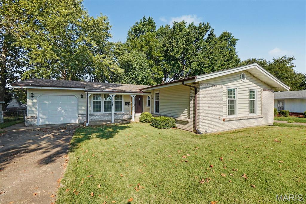 Embrace the warmth of a good life in this affordable move in ready home. Entryway greets you with ceramic tile and coat closet. Large living room and flows into dining room. Hardwood under all carpets, potential to make gleaming hardwood in this area. Kitchen and family room together make great entertaining and eat in while watching the game. Vinyl plank on floors, lots of Anderson windows, hardware on kitchen cabinets, tile backsplash, disposal, and all appliances stay. Family Room has gas fireplace, but owner hasn't used. Primary has spacious room, natural light, huge closet, and it's own full bath. Primary bath has tile shower, pedestal sink, and wall cabinet for extra storage. 2 more bedrooms and a hall bathroom that has a tub complete the main level. Lower level has a large rec room perfect for playroom, movie theater, or exercise area. Still more room, another room for office or hobbies. There's a workbench, cabinets, countertop, and another fridge in basement. Access to backyard make it perfect. Garage has shelving for storage, garage door opener, and door to back make it easy for lawn care. You'll love the spacious covered deck, lovely shade tree, partially fenced backyard. New roof on Jan '26, upgraded panel, 50-gallon hot water 5 yrs old, AC 3 yrs old, and all of this with a beautiful park across the street. Possibilities to make this your home, with your style are endless. Let the autumn winds guide you home. Make your appointment today!