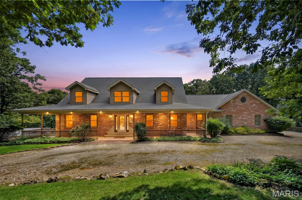 Beautifully maintained and updated 4 bedroom 4.5 bath home on 47+/- acres near Bourbon, MO.  An amazing country setting filled with woods and wildlife.  This custom homes features an inviting covered front porch, 2x6 construction, and lots of woodwork.  The main floor starts with 2-story entryway, oak flooring, a main floor master suite, large living room, kitchen with custom cabinets, breakfast and a dining room. Upstairs are two more spacious bedrooms and a full bathroom.  The finished walk out lower level includes a 9 ft pour, an extra bedroom, craft room, wet bar, full bathroom and lots of storage. The attached 3 car garage is oversized, has A/C, a 1/2 bathroom and attic access. An additional newer outbuilding with electric provides plenty of space for all your toys or hobbies.  Schedule your private tour today and come see everything this property has to offer. Just 5 miles from Bourbon and I-44 and only an hour from St. Louis.