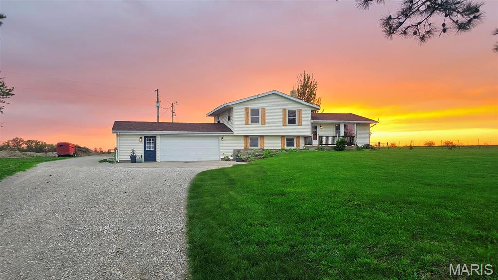 Home Warranty included! Excellent equestrian hobby farm on 9.42 acres just outside Mexico, MO! Set up for horses or cattle with fencing and cross-fencing, this property includes a 42' x 78' barn featuring 3 horse stalls, room to expand, and two sliding doors. Plenty of parking for trailers and equipment and no restrictions. This versatile multi-level offers 4 bedrooms, 2.5 bath. Built in 1974 boasts plenty of light on every level. Updated kitchen with granite counters and abundant cabinetry, flexible living/dining space, and access to the patio and backyard. Upper level includes 3 bedrooms and 1.5 baths. Lower level features a large family room with garage access to the 2-car attached garage laundry with half bath. Bottom level offers a 4th bedroom ideal for guests or home office.
This home offers space on every level. Located on just 1.5 miles of gravel with easy year-round access, this property offers privacy with convenient access to Hwy 54 and Route D--the perfect balance of country living and proximity to town.