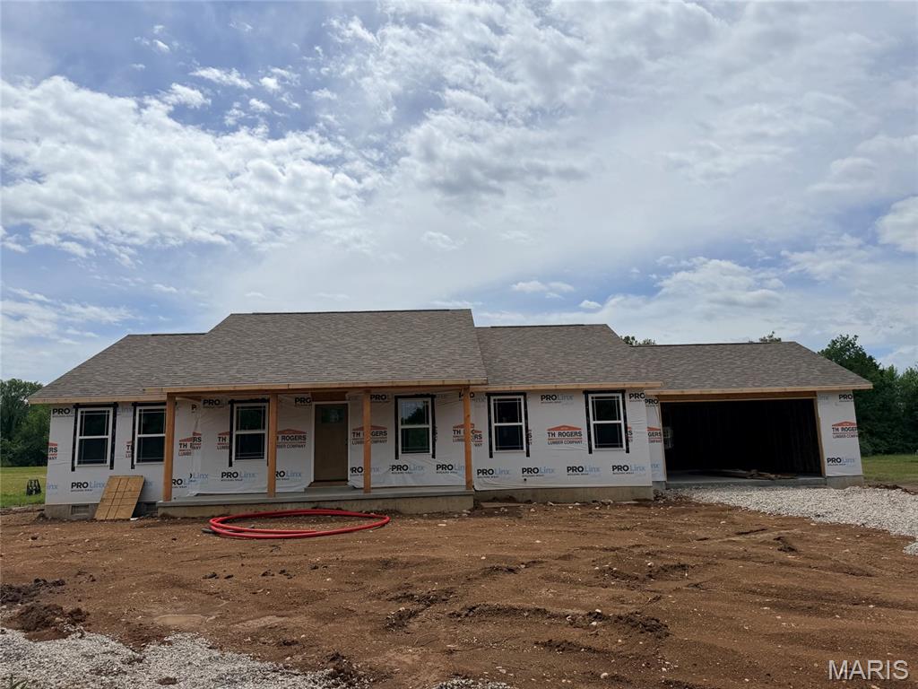 BRAND NEW CONSTRUCTION!  Yes, affordable living with a country setting is now within your reach! This 1,664 sf home is currently under construction with a target completion date of July 31. It sits on a 1.62 acre lot ON PAVEMENT within the Lebanon school district. The home offers an open layout with vaulted ceilings & luxury vinyl plank flooring throughout, with three bedrooms, 2 baths, and a 2-car attached garage. The kitchen will feature a large center island, granite or quartz countertops, custom cabinets, and all stainless-steel appliances will be included.  With a split bedroom floor plan that buyers love, the primary suite offers a roomy walk-in closet, attached bath with double vanities, and a walk-in shower. Act now and you can even make a few color choices as the interior is being finished! Enjoy peaceful views and sunsets while sitting on your back deck each evening. 1 year Builder’s warranty is included.