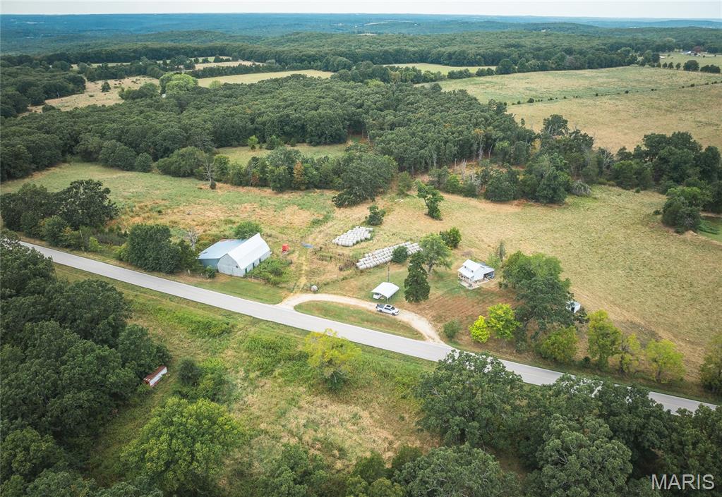 Just under 3 miles from Belle, this 74.32 m/l acre property combines the charm of country living with plenty of usable land. A nostalgic, rustic barn with lean-to adds character and provides space for hay, equipment, or even creative repurposing. About three-quarters of the acreage is lush pasture, ideal for livestock or hay production, with the remaining land in woods and a valley offering privacy and scenic views. Additional features include a shed with full basement and lean-to, some fencing, a pond, and a well. With its mix of open land, natural beauty, and functional farm structures, this property is perfect for a working farm, hobby ranch, or as the setting for your dream home in the countryside.