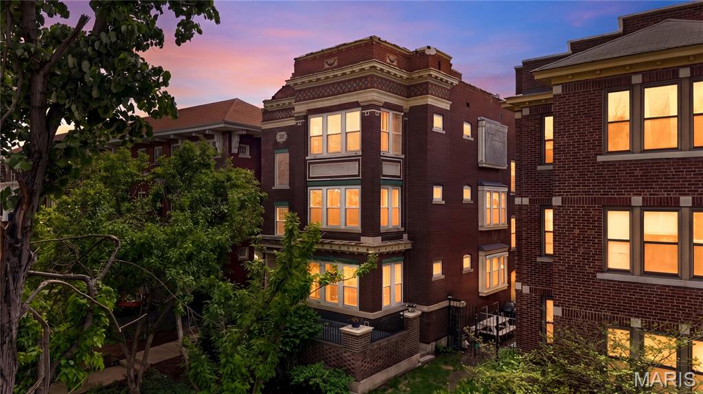 Welcome to this stylish 3-bedroom, 2-bath first-floor condo with large private patio in the highly sought-after DeBaliviere neighborhood. This spacious 1,632 sq. ft. end unit offers a flexible, open layout and exceptional outdoor living, all in an unbeatable central location near Forest Park, public transit, Washington University, SLU, Clayton, and the Central West End. The inviting living room features hardwood floors, a gas fireplace, built-in bookcases, and beautiful stained glass windows. A light-filled dining area opens to an oversized private patio—perfect for entertaining or relaxing outdoors. The modern eat-in kitchen is thoughtfully designed with stainless steel appliances, quartz countertops, marble backsplash, a center island, beamed ceilings, ample cabinetry, and a charming window seat. The primary suite includes a walk-in closet and a versatile sunroom ideal for a home office or retreat. Two additional bedrooms and two updated bathrooms with custom finishes provide comfort and flexibility for guests or family. Additional highlights include in-unit laundry, one secure off-street parking space, and a large private storage area. The HOA covers exterior maintenance, some insurance, landscaping, sewer, snow removal, trash, and water. Residents also have the option to join nearby Waterman Pool which offers a refreshing neighborhood escape just moments away, nestled in the heart of the desirable DeBaliviere Place community. Surrounded by lush green space, this resident-favorite spot features multiple swimming depths, shaded seating, and a relaxed, family-friendly atmosphere—perfect for enjoying warm St. Louis summers close to home. Certificate of Passed Inspection available upon request. Interested in the Live Near Your Work Program? See your eligibility at https://lnyw.wustl.edu/eligibility/. A refined residence combining character, modern updates, and an exceptional location.