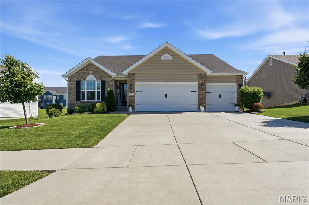 Welcome to 104 Hannahs Mill Dr, a meticulously maintained residence in the heart of Lake St. Louis. 
From the moment you arrive, the incredible pride of ownership is on full display. Step inside to discover an airy floor plan boasting soaring ceilings with an abundance of natural light. The kitchen serves as the heart of the home, featuring pristine finishes, an expansive island, and ample cabinetry—perfect for casual family mornings or holiday entertaining. Retreat to the spacious primary suite, complete with en-suite and generous walk-in closet. Two additional spacious bedrooms provide ample space for family, guests, or a dedicated home office. If one floor wasn't enough, the basement is ready for your custom finishes. Step out back to enjoy your outdoor oasis. Perfectly upgraded for low-maintenance relaxation and weekend barbecues, with a composite deck, lower concrete patio, and irrigation system. Every inch of this home has been lovingly cared for and carefully curated. Enjoy the perfect blend of indoor modern conveniences, upgraded outdoor living, and access to all the fantastic amenities Lake St. Louis has to offer.