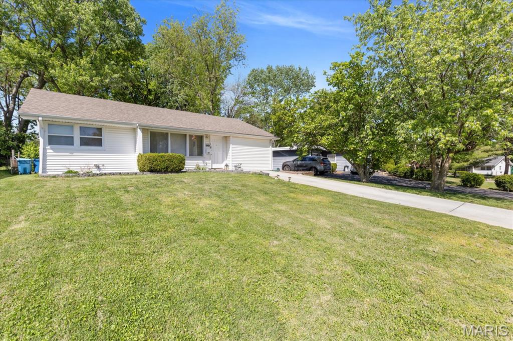 Located just minutes to Saint Louis Airport, downtown, parks, restaurants, shopping and entertainment this immaculate one level three bedroom ranch with two year old architectural roof will put you within 15 minutes of so many places to play, relax, or enjoy the sunset on the patio.  Convenient off street parking for two vehicles - walk up a gently sloping front yard to a welcoming entry.  Enter to be greeted by a light and bright great room large enough for a dining area in addition to comfortable seating for guests.  Kitchen has newer black appliances with gas stove and lots of counter space.  Add a bar top table for eat in convenience.  Large Primary Bedroom has double closets which are duplicated in the other two nice sized bedrooms.  Updated and very clean hall bath.  Convenient main floor laundry.  Newer laminate flooring throughout compliments the decor.   Enjoy morning coffee on the large patio in the oversized fenced backyard giving you plenty of room to play or garden.  Some privacy fence.  New HVAC installed within the last year.  Come take a tour of how to make this lovely home your own.