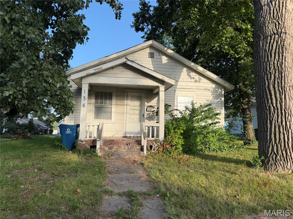 Outstanding opportunity in East Alton! This 2-bedroom, 1-bath home offers plenty of potential for an owner-occupant or investor looking to add their personal touch. The home features a spacious living room, dining room, kitchen, enclosed back porch, and a full unfinished basement providing abundant storage space. Outside, you'll find a nice yard and a detached one-car garage. Conveniently located near shopping, restaurants, schools, parks, and major roadways. Property is being sold AS IS. Seller will make no repairs and will not provide a passed occupancy permit. Don't miss this opportunity to build equity and make this home your own!