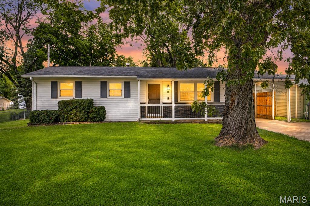 Welcome home to this charming ranch offering a comfortable, easy-flowing layout with plenty of space to make your own. Step inside to a bright and welcoming living room where beautiful hardwood floors and natural light create an inviting first impression. The main level continues into the dining area and eat-in kitchen, offering a functional space for everything from weeknight dinners to gathering around the table with friends and family. Down the hall, you’ll find three comfortable bedrooms and a full bathroom, keeping everything you need conveniently located on one level. Downstairs, the partially finished basement adds even more flexibility with plenty of room for a second living area, home office, workout space, hobby room, or whatever best fits your lifestyle. You’ll also find additional storage and a roughed-in bathroom, giving the next owner even more opportunity to customize the space over time. With laundry hookups available both upstairs and in the basement, you can choose the setup that works best for you. Outside, the spacious, level backyard offers plenty of room to relax, play, garden, or entertain, complete with a deck for enjoying warm evenings outdoors and a shed for additional storage. A covered attached carport and driveway add everyday convenience. Located within the Francis Howell School District, this home brings together a functional main-level layout, versatile additional living space, and a backyard ready to be enjoyed. Schedule your showing and come see everything 11 Toelle Drive has to offer!
