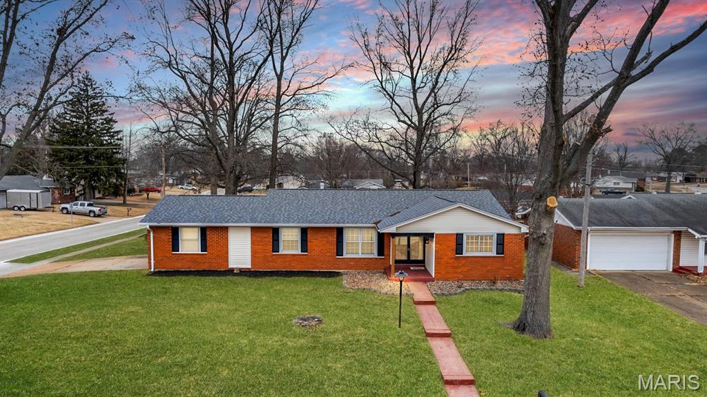 Fully refreshed, all-brick ranch on a large corner lot offering the open-concept layout buyers are craving, paired with solid construction and room to grow. Fresh paint and updated flooring flow throughout the main level, creating a bright, cohesive feel from the moment you step inside.

The expansive great room delivers excellent flexibility for everyday living and entertaining, while the separate dining room adds defined space for hosting, working from home, or gathering with family and friends. The kitchen opens seamlessly to the dining area and features ample cabinetry, newer appliances, and easy access to the standout 25’ x 17’ covered patio — a rare and valuable extension of the living space.

The fully fenced backyard offers privacy and room to relax, entertain, or play. Downstairs, the partially finished lower level includes a large rec room just waiting for your finishing touches — ideal for a media room, play space, or home gym.

Additional highlights include four-sides brick construction, newer windows, a side-entry two-car garage, and a layout that truly works. Move-in ready with space, function, and flexibility — this one checks the boxes.