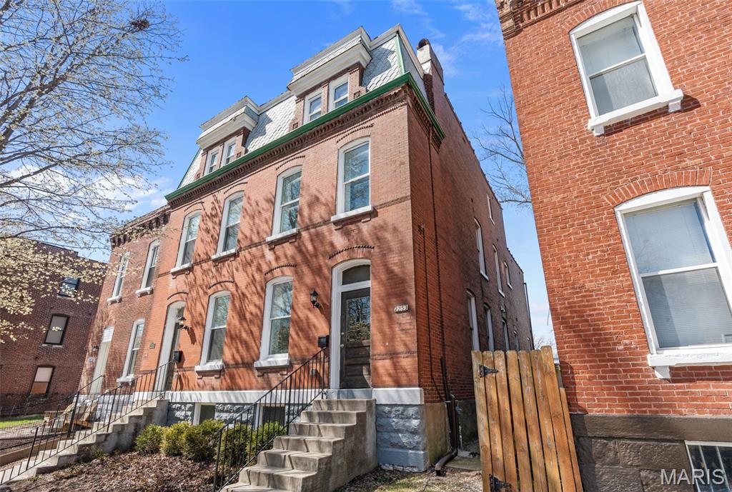 Welcome to this beautifully renovated all-brick single-family town home in the heart of McKinley Heights. This expansive 4-bedroom, 3.5-bath home offers high ceilings and a thoughtfully designed three floor layout that feels both refined and inviting. The peninsula-style kitchen is a standout, featuring sleek stainless steel appliances and generous workspace—ideal for entertaining or everyday living. Updated bathrooms, in-unit laundry (included), central air, and ceiling fans throughout add modern comfort and ease. Enjoy multiple outdoor living spaces including a balcony, deck, and a large fenced backyard with patio. Ideally situated near neighborhood favorites, parks, and dining. One-year lease minimum. Cats or dogs up to 30 lbs considered. Schedule your private showing today.