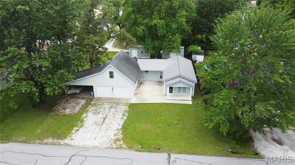 311 S Wentz St | Montgomery City | Built 2021 | 3 Bed (Loft Included) | 1 Bath | 2 Lots

Some homes are built.
This one was crafted.

Built in 2021 by an owner with a true eye for detail, this property is filled with thoughtful touches you won’t find in a standard build. From the moment you walk in, it feels different…intentional, functional, and full of character.

The oversized kitchen is the heart of the home, featuring custom soft-close cabinetry and plenty of space to cook, gather, and live. It opens seamlessly into a large living area, creating an easy, open flow that makes the space feel even bigger than it already is.

The bathroom? Oversized and designed with comfort in mind.
The master? Complete with a large walk-in closet that actually makes sense for real life.

Then there’s the loft…a flexible space that can serve as a third bedroom, a man cave, office, or creative hideaway—with ample storage to go with it.

Step outside and the home opens up even more.

The unique U-shaped design wraps around a large, semi-secluded front patio that feels like your own private courtyard—perfect for morning coffee, evening unwinding, or hosting without feeling exposed.

Sitting on two city lots, the property gives you space that’s hard to find in town. You’ll also find:

Attached 2-car garage
Additional carport
Two outbuildings, including one with electric

Every inch of this property reflects care, intention, and craftsmanship.

If you’re tired of cookie-cutter homes and want something with soul…this is one you need to see in person.