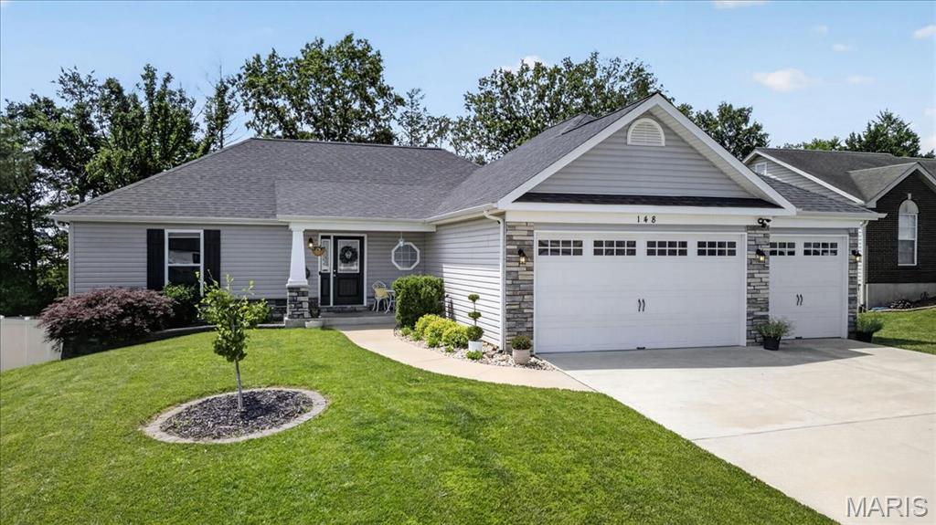 OPEN HOUSE SATURDAY 6/6 FROM 1-3PM!
Ready to feel right at home? This is the one! You'll love the curb appeal and the wide driveway leading to your 4, yes FOUR, car garage! As you enter you'll notice the vaulted ceilings offering an airy, inviting appeal, with durable vinyl plank flooring that flows throughout the main level. The large, open concept living room features a cozy decorative fireplace with bonus storage. You'll adore entertaining and cooking in your new kitchen, featuring granite countertops, a corner pantry, new DW (2025) and a handy breakfast bar! The convenient main floor laundry room includes a useful utility sink. The owners suite boasts a large walk in closet & an updated bath vanity. All the bedrooms have new carpet! Downstairs you'll find a partially finished basement that's just waiting for you final touches! Offering a large common space, the beginning of a custom bar, and a large room currently used as an office also boasts an additional half bath! Outside you have a gardeners oasis, with multiple raised planters and a backdrop of mature trees. The 4-car garage offers 3 across, with the 3rd space offering a tandem double depth setup... perfect for a workshop, boat, toys, or projects! This one won't last long - schedule your showing today!