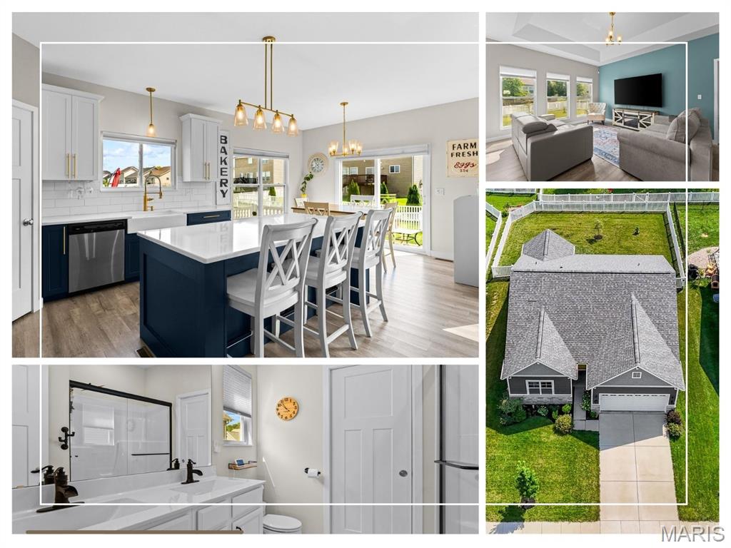 This 2023-built UPGRADED Fulford Homes Whitney offers newer construction without the added cost of all those post-closing projects! The showstopper kitchen features an oversized navy island with large, deep storage drawers, quartz countertops, farmhouse sink, tile backsplash and brushed-gold hardware and lighting. The kitchen opens to an inviting living area enhanced by a beautiful coffered ceiling. All three bedrooms and laundry are conveniently located on the main level, while the finished lower level adds a spacious family room, full bath and tons of storage. Blinds are installed, the backyard is fenced and the primary closet has been professionally customized. Upgraded craftsman-style interior doors, EV charging outlet, SumpJet water-powered backup system and more! So new it's exempt from the municipal occupancy inspection.  Move right in and enjoy the upgrades and thoughtful improvements already in place. Conveniently located near shopping, dining, parks, Scott AFB and everything the Metro East has to offer.