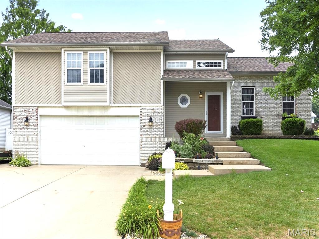 This gem of a unique home is perfect for an easy commute to the places you go, but with a small town living feel. This tri-level home is just blocks from the beautiful public park with splash pad, pickleball, playgrounds and more. You will be welcomed to this home with beautiful landscaping and great curb appeal. Main level has an open floor plan and large family room/dining room space which has the flexibility you want in a floor plan, plus cathedral ceilings. The nearby kitchen has granite countertops, only 3-year-old appliances, tile backsplash, and space for a portable island, or eat in kitchen too.  It's convenient access to the amazing level backyard and newer 17 x 20 low maintenance Trex deck with accent lighting and clean easy storage under the deck make this home perfect for entertaining.  Room enough for a swimming pool too and the privacy fence is ready to go. The upper living space is a great bonus feature with a spacious loft area with skylights, perfect for a home office, extra family room, or just a quiet space to escape.  Guest bedrooms are well apportioned and feature a cozy window seat too.  Primary bedroom suite has exactly what you need with a walk-in closet, double vanity sinks, and a jacuzzi tub.  Bonus points in this home with the light filled unfinished basement area, perfect for finishing, or using for storage. The great oversized 26 x 30 2-car garage just may fit your boat, or an extra car or two. You'll love the room to expand with some workshop space or just enjoy the extra room for storage. Want to water your plants for free? This home has a private well just for watering your plants! Water heater was replaced in 2022 and has 12-year warranty.  Seller also providing additional home warranty for extra peace of mind. New roof in 2025! Call your favorite Realtor for a private tour!