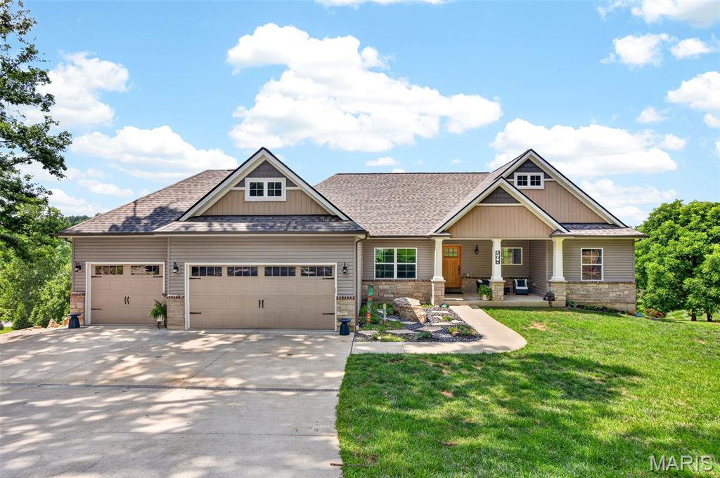 Welcome to the highly sought-after GATED COMMUNITY of AUGUSTA SHORES! Nestled on a PRIVATE DRIVE and situated on 2.2 ACRES overlooking a BEAUTIFUL TREE-LINED BACKDROP, this SPRAWLING RANCH offers 2,293 SQ. FT. OF LIVING SPACE and an exceptional blend of luxury, comfort, and privacy. Enjoy the lifestyle Augusta Shores is known for, featuring THREE STOCKED LAKES, SWIMMING POOL, BASKETBALL & TENNIS/PICKLEBALL COURTS, WALKING TRAILS, CLUBHOUSE, PAVILION, FIBER OPTIC INTERNET, and beautifully maintained common grounds, all within close proximity to LOCAL WINERIES, KLONDIKE PARK, and the KATY TRAIL.
A desirable SPLIT-BEDROOM floor plan offering enhanced privacy with the Spacious Primary Suite thoughtfully positioned on one side of the home and the secondary bedrooms located on the opposite wing.  Finishes include SPARKLING HARDWOOD FLOORING, RECESSED LIGHTING, ARCH ENTRYWAYS, 6-INCH BASEBOARDS, and AN ABUNDANCE OF NATURAL LIGHT throughout. The CHEF’S KITCHEN is designed to impress with GRANITE COUNTERTOPS, GLASS TILE BACKSPLASH, 42-INCH CABINETRY, UNDER-CABINET LIGHTING, STAINLESS STEEL APPLIANCES, CUSTOM HOOD VENT, GAS COOKTOP, DOUBLE OVENS, SOFT-CLOSE DRAWERS, and a SPACIOUS BUMP-OUT DINING AREA.
The inviting FAMILY ROOM features a WOOD-BURNING FIREPLACE and EXPANSIVE WINDOWS showcasing the peaceful TREE-LINED VIEWS. An additional living area offers flexibility for a FORMAL DINING ROOM, HOME OFFICE, or SITTING ROOM.
The SPACIOUS PRIMARY SUITE includes a luxurious  WALK-IN TILE RAIN SHOWER with MARBLE SEAT, FRAMELESS GLASS ENCLOSURE, and CULTURED MARBLE VANITY TOPS. 
Additional features include a MUDROOM, SLATE TILE LAUNDRY FLOORING, OWNED WATER SOFTENER, and OWNED REVERSE OSMOSIS SYSTEM.
The WALK-OUT LOWER LEVEL is ready for your finishing touches, featuring Three EGRESS WINDOWS and a BATHROOM ROUGH-IN, creating ENDLESS POSSIBILITIES for additional living space. The convenience of TWO WASHER & DRYER HOOK UPS ( Main Level & Lower Leve
Recent updates include a NEW ROOF.  The  3-CAR GARAGE and EXPANSIVE DRIVEWAY provide ample parking and storage.
A rare opportunity to enjoy ACREAGE, PRIVACY, and RESORT-STYLE AMENITIES in one of Augusta’s most desirable communities. Don’t miss your chance to call AUGUSTA SHORES home! A MUST SEE!