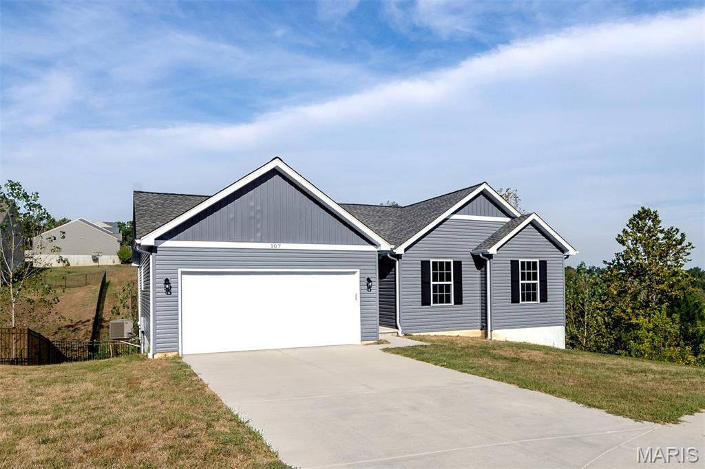 Welcome to this beautiful ranch home tucked away on a quiet cul-de-sac in the Festus School District! Offering modern style, thoughtful design, and plenty of room to grow. This 3-bedroom, 2-bath home features an inviting open floor plan with abundant natural light throughout. The spacious kitchen is the heart of the home, featuring custom cabinetry, stainless steel appliances, and a large center island with additional cabinet storage that opens seamlessly to the main living area. Wood veneer flooring runs throughout the main level, creating a warm, cohesive feel. The main-floor laundry adds convenience and functionality. The primary suite provides a comfortable retreat with a private ensuite full bath featuring double sinks and a walk-in closet. Two additional bedrooms offer flexibility for family, guests, or a home office. Step outside to enjoy the brand-new composite deck overlooking the newly fenced backyard. The full walk-out basement offers incredible potential for future finished living space, with egress windows and plumbing rough-in already in place. Whether you envision a family room, additional bedrooms, a home gym, or entertaining space, the possibilities are ready for you to make your own. The basement also provides ample storage space. A two-car garage completes the package. Built in late 2024, this beautiful ranch combines a desirable layout, modern finishes, outdoor upgrades, and a quiet cul-de-sac setting, all offering the comfort and convenience of a newer home with room to make it your own.