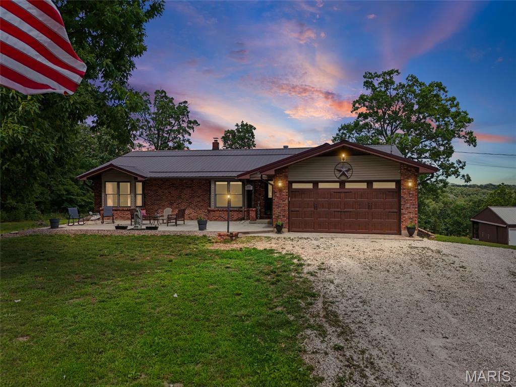 If you're looking for private, serene country living, this is it! This well-maintained 3 bed / 2 bath ranch sits on 6 acres in unrestricted Hillsboro. The beautiful property has so much to enjoy before ever walking through the front door. The welcoming brick patio adds so much character as you approach the home. Head inside to see the open floor plan with a spacious living room, vaulted ceilings, and gas fireplace. The large kitchen offers granite countertops, newer appliances, and a large island with plenty of space for family and friends. Head to the dining room and out the french doors to see the newer composite deck and enjoy the view! Outside you'll see the HUGE 30 x 50 outbuilding. Approximately two-thirds of the outbuilding has concrete floors, while the other side has 3 horse stalls. Yes, that's right! You can have horses on this property! This is an incredibly unique find in Hillsboro and is sure to sell quickly. Schedule your showing today!