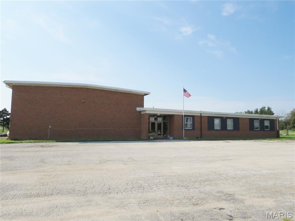 ENDLESS POSSIBILITIES! This large brick commercial building offers an exceptional opportunity for a variety of business uses, with approximately 3 acres to work with or expand.  Currently utilized as office space with warehouse areas, the property features 3 bathrooms, a convenient walk-in safe, loading dock area, and lots of paved parking. Seller updates include 3-phase electric and a durable rubber membrane roof. With ample space, excellent functionality, highway frontage and room to grow, this property is ready to accommodate your business vision!