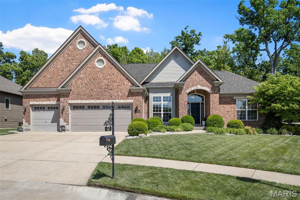 A stunning ranch-style home featuring a seamless, open-concept design. The elegant entry foyer showcases tile flooring and a sophisticated see-through fireplace between the great room and eat-in kitchen. The eat-in kitchen transitions effortlessly to a meticulously landscaped outdoor oasis, designed for ultimate seclusion. The expansive stamped concrete patio provides ample space for multiple seating and dining arrangements surrounding an inground saltwater pool. The primary suite serves as a true retreat, offering a spacious layout, walk-in closet, and an ensuite bathroom with a separate soaking tub, shower, and private water closet. This thoughtful floor plan places two additional bedrooms and a full bathroom on the opposite side of the house for maximum privacy. Additional highlights include a convenient main-floor laundry, powder room and mudroom, plus a partially finished basement providing approximately 900 sq. ft. of versatile bonus space.