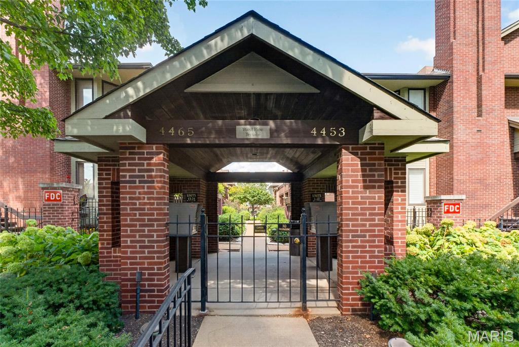 Tranquil, resort-style living in the heart of the Central West End! This beautifully updated and remodeled ground-level condo offers an exceptional combination of style, space, and location. From the moment you step inside, you’ll be welcomed by an expansive open floor plan featuring an ample living room with fireplace, adjoining dining area, and a beautifully updated kitchen with gorgeous quartz countertops installed in July 2025.  The oversized primary suite feels like a private retreat, complete with a spacious walk-in closet, private access to the private deck in the back, and a beautifully updated bath featuring a double vanity and upgraded shower. The generously sized second bedroom offers plenty of space for guests, an office, or additional living needs, with a second fully updated full bath nearby.  Luxury vinyl plank flooring flows throughout the entire condo, complemented by newer paint throughout and upgraded blinds (2024). The unit is all electric and features an in-unit washer/dryer combo for added convenience. An attached parking garage provides two designated side-by-side parking spaces, along with a private storage closet.  Enjoy the ease of ground-level living along with the amenities and atmosphere of a resort, including beautifully maintained lush landscaping and a private, fenced community pool.  Ideally located just minutes from the best of the Central West End, including acclaimed restaurants, Whole Foods, hospitals, Forest Park, The Zoo, shopping, entertainment, and more. A rare opportunity to enjoy spacious, updated living in the most vibrant and sought-after neighborhood!