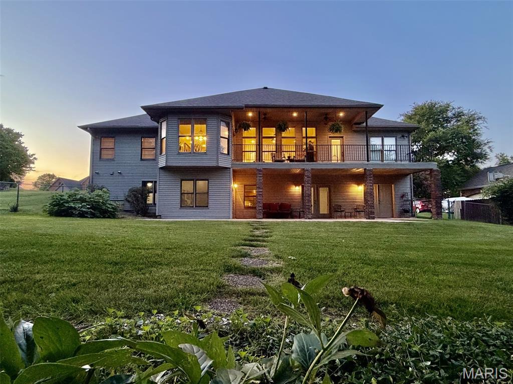 FINALLY a little peace and quiet in the LAP of LUXURY- This PREMIER Meadows property backs up to open ground- the subdivision is well established and these owners have watched it from the start!  This home was custom built for the original owners who have carefully cared for and curated it- From the components to the grounds, this place is a model of luxurious style and comfort.  Adjustments to the original build include additional windows throughout for more natural light, additional bump out for the breakfast nook and some elegant design cues you'll just have to see to believe like the travertine backsplash in the main suite’s soaker tub.  Floor to ceiling windows and ventless gas fireplace in the living area means a commanding view of kitchen, back yard and living spaces in your home. Spend HOURS in the Gloriously overbuilt kitchen complete with dine/in bar, double ovens (one convection), trash compactor and updated stainless steel appliances (voice activated hood vent coming soon!),bright contrasting countertops with dark, warm custom cabinetry; just a massive amount of cabinet space for filling the dining table in that formal dining area. As you enter the home observing ultra high ceilings and beautiful blonde wood flooring you can turn left directly into the study/office so working from home doesn't mean dragging your customers to the basement; in fact single level living is a must here, oversized laundry is near the garage for ease and convenience.  The MASSIVE open area in the basement with 7 piece Yamaha Surround Sound and another ventless fireplace makes for a GREAT secondary living quarters, the bar area with additional fridge and room for a full sized pool table isn't even the icing on the cake- this basement has not only a full bedroom and bathroom suite but also a HUGE storage space spanning the entire length of the basement and leading to the John Deere room, which makes three entrances/exits to the flat back yard with additional concrete pad for the ultimate home owner options- Add more bedrooms or set up a bow shooting range (tinkering shop, secret bat cave or Minion's Lair?)  Lower deck is wired for a hot tub, upper deck is outfitted with multiple overhead fans so there's always a good breeze if you want one. Sunrises and Sunsets BOTH from the private back deck of this north/south facing home so you get to ENJOY the sun, not be baked by it twice a day. You’ll ALSO enjoy DuraDek brand exterior flooring on the top floor patio too so maintenance is a breeze- that upper deck has separate entrance/exit for that Main Bedroom Suite where your oasis becomes complete with high ceilings, magnificent walk in closet and deep soaker tub, both with privacy protected natural light.   Of course it has all the best appointments and components and all still in amazing condition OR recently updated, something you'll just have to see for yourself to truly appreciate it.  Schedule your private showing today.