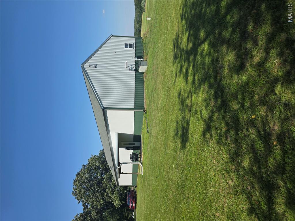 Unique shouse opportunity on a level lot with some mature trees, offering the perfect blend of country living and convenience! This building features 12-foot ceilings and 2x6 walls, providing an open and spacious feel with endless possibilities. Conveniently located approximately 2 miles from I-44 Exit 239, making commuting easy while still enjoying a private setting. Seller states there are no restrictions. Bring your vision and make this property your own!