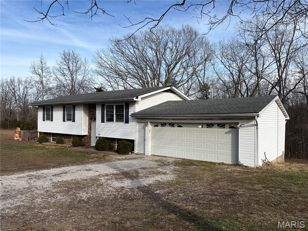 $219,995 - 9+ Acres - Washington County, MO
If you’ve been looking for a little room to breathe, this one might be calling your name. This 1976 raised ranch / split-foyer home sits on over 9 acres in a rural setting only 10 minutes north of Viburnum, Missouri, in the Valley R-6 School District. The home offers a solid layout with a lot already done for you. Updates include a newer roof, new electric hot water heater, newer electric furnace, and custom kitchen cabinets. The main level features a traditional 3-bedroom floor plan, plus a built-on addition that makes a great family room, game room, or even a large sleeping room—plenty of flexibility depending on your needs. Downstairs, the basement adds even more usable space with a utility room, second bathroom, family room, sleeping room, and a very nice kitchenette—perfect for guests, extended family, or extra living space. Outside is where this property really shines. With just over 9 acres and two wells, you’ve got room for hobbies, animals, gardens, or simply enjoying the peace and quiet. The Mark Twain National Forest is just a mile away, offering excellent hunting, hiking, and outdoor recreation. You’re also within an hour of some of Missouri’s favorite spots like Dillard Mill State Park, Council Bluff Lake, Elephant Rocks, and Johnson Shut-Ins. Crystal-clear streams are only a mile away, making summer days perfect for wading, playing, and cooling off. The setting, the space, and the location are all here. The only thing missing is you. Let’s get the ball rolling and make this place your next home.
