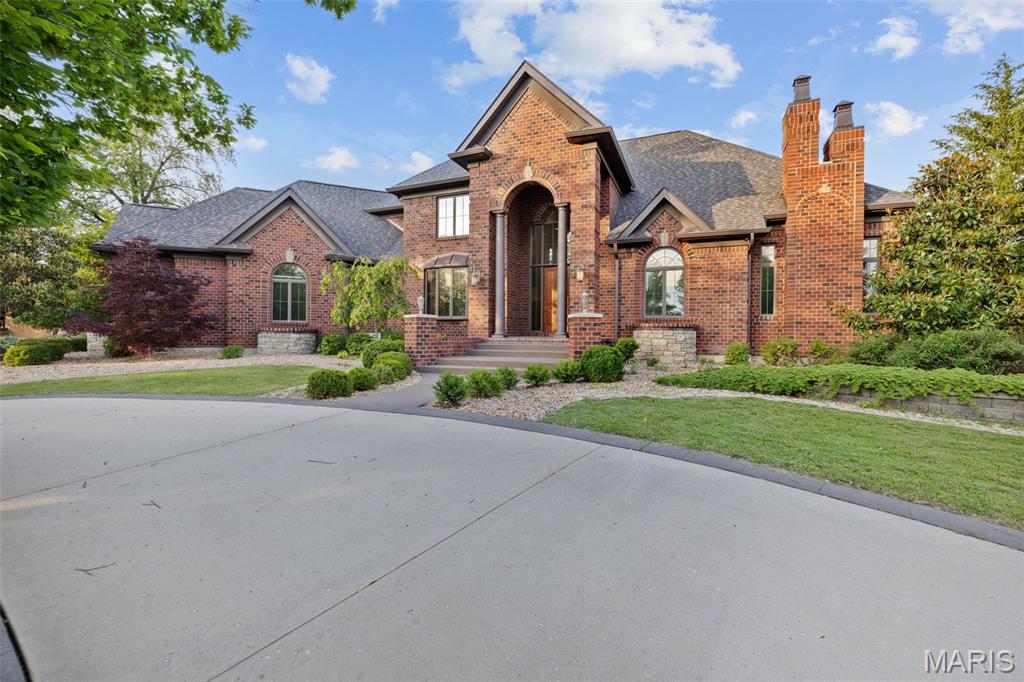 Where luxury meets Lindbergh Schools—this 4 bed, 7 bath estate offers over 6,200 sq ft of refined living. Step inside to immaculate hardwood floors and a dramatic 2-story foyer overlooking the private backyard through expansive picture windows. Just off the entry, a dedicated office with custom built-ins offers a quiet place to work. The main floor features a luxurious primary suite with a gas fireplace, sitting area, jetted tub, and custom walk-in closet. A chef’s dream kitchen boasts a Viking range, double ovens, wine fridge, drink fridge, ice maker, instant hot water, and a custom breakfast bar. Entertain in the hearth or living rooms—both with fireplaces—or host guests in the formal dining room. Upstairs includes three en-suite bedrooms and a loft with retractable skylights, electric WiFi blinds/windows, and a retractable TV. The finished lower level offers a full gym with low-EMF sauna, custom wet bar, full bath, entertainment space, and secure vault. Enjoy a level 3 architectural roof (2021) with all copper replaced, tuckpointed chimneys, and new gutters. Additional highlights: whole-home ethernet, 4-car garage w/ HVAC, Main floor custom remote controlled blinds, Bullfrog hot tub, SunSetter patio furniture, Nest thermostat/doorbell, 2 whole-home gas generators, custom mailbox, and an adjustable basketball hoop. More photos are coming soon! Showings begin at 5:30pm on 5/27/25. Don't miss your chance to call this space your new home!