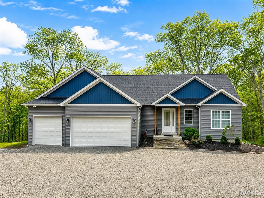Experience peaceful country living in this stunning 2- year old ranch home nestled on 5 mostly wooded, unrestricted acres in the picturesque Femme Osage Valley. Ideally located just 3.5 miles from the charming town of New Melle, you'll enjoy the perfect balance of privacy and convenience, with nearby wineries, parks, and scenic countryside. 
This thoughtfully designed home offers 2,013 square feet of main-level living with 3 spacious bedrooms, 2 full bathrooms, and quality finishes throughout. The open concept floor plan features soaring 10-foot ceilings, luxury vinyl plank flooring, quartz countertop, a large center island, and a stylish coffee/beverage bar that's perfect for entertaining. 
The primary suite and secondary bathrooms showcase beautiful custom tile work, which continues into the laundry room for a cohesive, upscale feel. 
Step outside to enjoy the deck overlooking the peaceful wooded acreage- an ideal setting for relaxing, entertaining, or enjoying abundant wildlife and nature. 
Additional highlights include an oversized 3-car garage and a full unfinished basement with a bathroom rough-in, offering endless possibilities for future expansion and added living space.
Located in the highly sought after Francis Howell School District, this exceptional property combines modern luxury with the serenity of country living. Don't miss this rare opportunity to own a nearly new home on unrestricted acreage in one of St. Charles County's most desirable locations.