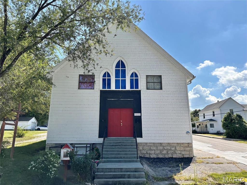Charming church building located in the heart of Festus! The main level consists of sanctuary, nursery, sound room and offices. Upper level has two additional office/classroom spaces. Lower level has space for storage, multipurpose area and 2 bathrooms. Building has been updated with newer siding, furnace and HVAC, hot water heater, flooring, etc. Off Street parking. Some Accessible Features Location: City