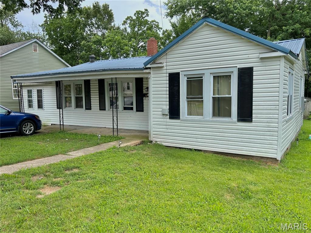Call to schedule your private showing today. 1134 sq. ft., 3 bedroom 2 bath home with one bedroom being non-conforming. Luxury vinyl plank flooring in the master bedroom and bathroom. Bedroom and bathroom have been recently updated. Vinyl siding, metal roof and vinyl windows. Concrete driveway, sidewalk and covered front porch. 10x10 covered back porch overlooking a nice back yard with a 14x14 garden shed with concrete floor. Large shade trees in the back yard. This property is located in a quiet area close to all of Salem's amenities. Within a 20 minute drive to Montauk State Park, Current River, Meramec River & Indian Trail.
