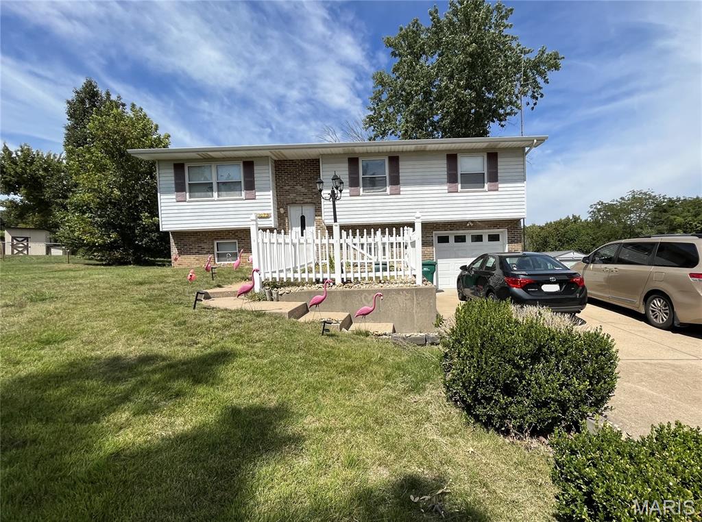 This 3-bedroom, 2-bathroom split-foyer home offers strong potential on a 0.34-acre lot. Featuring 966 sq ft of living space, the functional layout includes a finished lower level that expands your living options. Key mechanical highlights include a water heater replaced within the last few years and a newer roof. Connected to public water and septic, this property provides a solid foundation for buyers or investors looking to add value with personal touches.