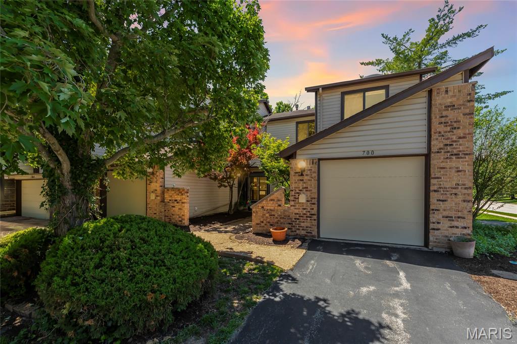 Charming 2-story townhome located in the sought-after Treetop condominiums in Ballwin! Offering over 1,500 square feet of living space plus a finished walkout lower level, this 2-bedroom, 2.5-bath home combines comfort, style, and convenience. The main level features an inviting kitchen with granite countertops, 42" cabinetry, stainless steel appliances, and a custom tile backsplash. The spacious family room boasts a cozy wood-burning fireplace and walks out to the back deck, perfect for relaxing or entertaining, with an adjacent dining area, and convenient half bath complete the main floor. Upstairs, you'll find a versatile living room/flex space, two generously sized bedrooms, and a full bathroom. The finished walkout lower level adds even more living space with a rec room, full bathroom, and access to the private patio. Enjoy fantastic community amenities, including two swimming pools, along with easy access to nearby restaurants, shopping, parks, and more!