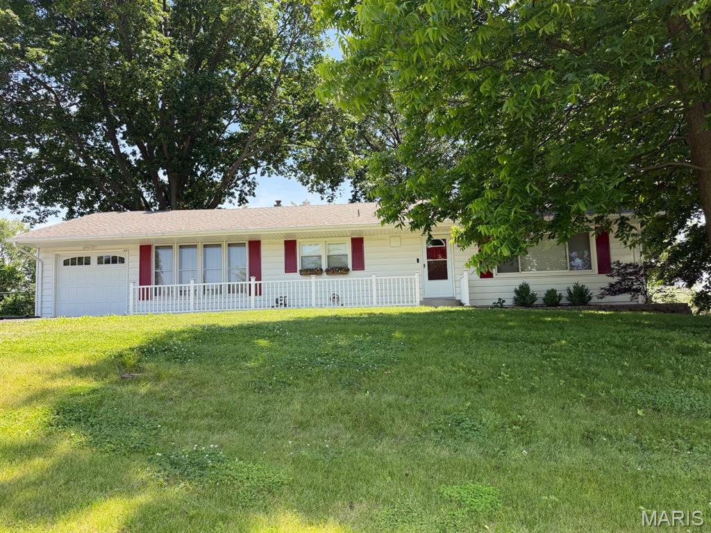 Welcome to 8 Wayne Street in the heart of St Charles..  This home has so much to offer.. Large lot with mature trees and fenced yard.  A warm welcoming family room with an electric fireplace.  The kitchen has plenty of space for a table and the island is mobile, move it to your preferred spot.  Appliances are included.  Garage has a newer door with opener and workbench.  Perfect set up for room mates with same size bedrooms.  Main level bathroom is updated and there is a lower level bathroom with a shower.  Electric panel is updated 200 amp service.  The roof replaced in 2019, the gutters have leaf guards with a lifetime transferrable warranty.  There is also a lifetime warranty on the bath fitter bath as well.  Come see this home soon!!
