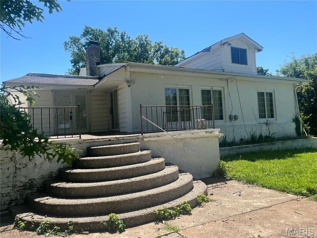 Welcome to 15000 Sinks Road in Old Jamestown!  This unique, 100+-year-old property is a rare find and is now available for new owners' tender loving care and enjoyment!  There's a lot to this place!  Nicely set back from the county road, the "Big White House on Sinks," ca. 1917 or earlier, is served by a shared driveway (a/k/a Jones Road on maps), and its own drive encircles the home.  You will not run out of parking here!  Highlights are:  3BR/1.5 BA/Main Floor Laundry/10+ Car Garage Space (1,332 sf for attached garage plus a 1,488 sf pole barn with concrete floor, two overhead doors and a service door), 6 beautiful, gently rolling acres and a country view to enjoy.  Main living area features Family Room, Great Room/Dining Room combo with fireplace and slider to front porch, spacious kitchen, big "mud room"/laundry room with access to LL, 3 nice-sized BRs, and a full bath.  Large primary BR (Hollywood glam-style BR suite negotiable), stairway to attic is in closet of secondary bedroom, and third BR has parquet flooring.  Updated tilt-in windows.  LL accessed via spiral stairway in main floor laundry.  LL was once used as family printing business.  Sellers are told that foundation is 6' thick concrete.  The walls are 12' tall.  Most items have been removed, but there is vintage litho/printing camera equipment and darkroom; sellers do not intend to remove these items.  Half bath in LL.  Gigantic garage addition.  Separate fruit/root cellar.  Pole Barn sits behind the home.  Property is being sold as-is/where-is.  Home needs work.  Listing Agent to accompany showings -- Please do not walk the grounds without an appointment.