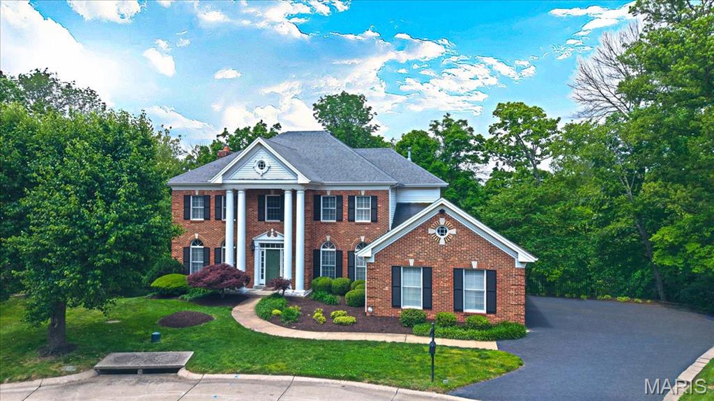 CHARM&MODERN LUXURY meet in this STUNNING 2story Georgian Colonial sits on a quiet cul-de-sac w/a serene, wooded setting.Step inside to find gorgeous oak hardwoods&detailed trim,plantation shutters throughout. The 2-story foyer welcomes you w/elegance leading to a private study, formal dining room&an inviting great room w/a cozy brick fireplace,wet bar,&beautiful built-ins.A chef’s kitchen crafted by Terbrock Design w/granite countertops, 42” cherry cabinetry, commercial-grade appl,8ft center island,flowing into a bright breakfast room w/French doors that open to a large deck.Upstairs, luxe owner’s suite features a coffered ceiling, spa-like marble bath w/freestanding Bain Ultra tub,shower spa,his & hers walk-in closets.3 MORE bedrooms,one with an ensuite and two sharing a Jack & Jill bath.Finished w/o LL has it all,a rec room w/granite bar,game room,fitness area, 5th BR&a full bath.Nearly an acre of private, wooded land w/dual decks&a 3car garage—this home is made for entertaining.