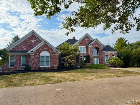 A rare opportunity to own almost 9 acres and 6,000+ sq ft of beautifully updated living space in the sought-after New Melle/Foristell area! Set on a picturesque property with an additional adjoining 3 acres, this impressive 4-bedroom, 4-full/3-half-bath home blends grand-scale living with the privacy and outdoor space buyers dream about.

Step inside the dramatic 2-story foyer, where a sweeping curved staircase sets the tone. The soaring 2-story Great Room is a showstopper with a brick fireplace, custom built-ins, balcony overlook and a spectacular wall of atrium windows extending to the walk-out lower level and filling the home with natural light.

The updated kitchen features abundant cabinetry, center island, planning desk, new countertops, flooring, lighting and fresh paint. Just beyond, the inviting Hearth Room offers a second fireplace and additional built-ins. The main-floor Primary Suite is a private retreat with a deep coffered ceiling, walk-in closets, access to the 3-season room and a spacious bath with dual vanities, jetted tub and separate shower.

Upstairs you'll find 3 bedrooms, 2 full baths, fresh paint and new flooring. The finished walk-out lower level boasts a fully wired Theatre Room, full bath, family room, rec/media space and generous storage.

Outside, enjoy your own private getaway with a large inground pool, 20x16 pool house with kitchen and additional half bath, new deck and acres of room to relax, entertain or explore. Major recent improvements include a roof less than a year old and all 3 HVAC systems recently replaced. Premium brand "Big Ass Fans", an oversized 4-car garage and circle drive complete the package.

Country-style privacy meets convenience, with Wentzville, St. Peters and Chesterfield approximately 20 minutes away or less. This is more than a home - it's the space, setting and lifestyle you've been waiting for.