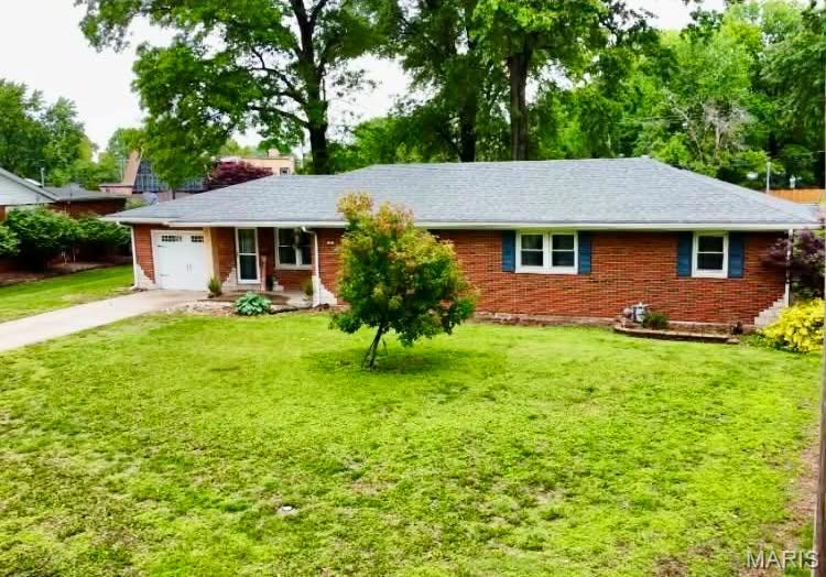 At 20 Oaklawn Drive, this single-family residence, with a huge, oversized back yard, in a beautiful quiet neighborhood, presents a unique opportunity for discerning buyers seeking a property with established character and potential. This three-bedroom residence offers comfortable living spaces with an open floor plan, multiple eating options with a kitchen island, and a large family room with a fireplace for those cozy nights, designed for both relaxation and everyday functionality. Complementing these private quarters are two well-appointed bathrooms, ensuring convenience for residents and guests alike. The unfinished basement is just waiting for your final touches.  There you will find plumbing for a 3rd bathroom, deep freezer and washer/dryer.  It has been waterproofed by Woods and hold 2 sumps pumps. New garbage disposal 4/2026, New sump pump 4/2026. Just add some fresh paint, update the flooring and doors and this one is ready to go! We invite you to experience the distinctive charm of this Granite City residence. All appliances stay with the home (stainless steel appliances age 2017).  Roof age 2015 and New Gutters 2024. This home is being SOLD AS IS! Seller to make no repairs.  (Any inspections held will be for buyer's purposes only.)