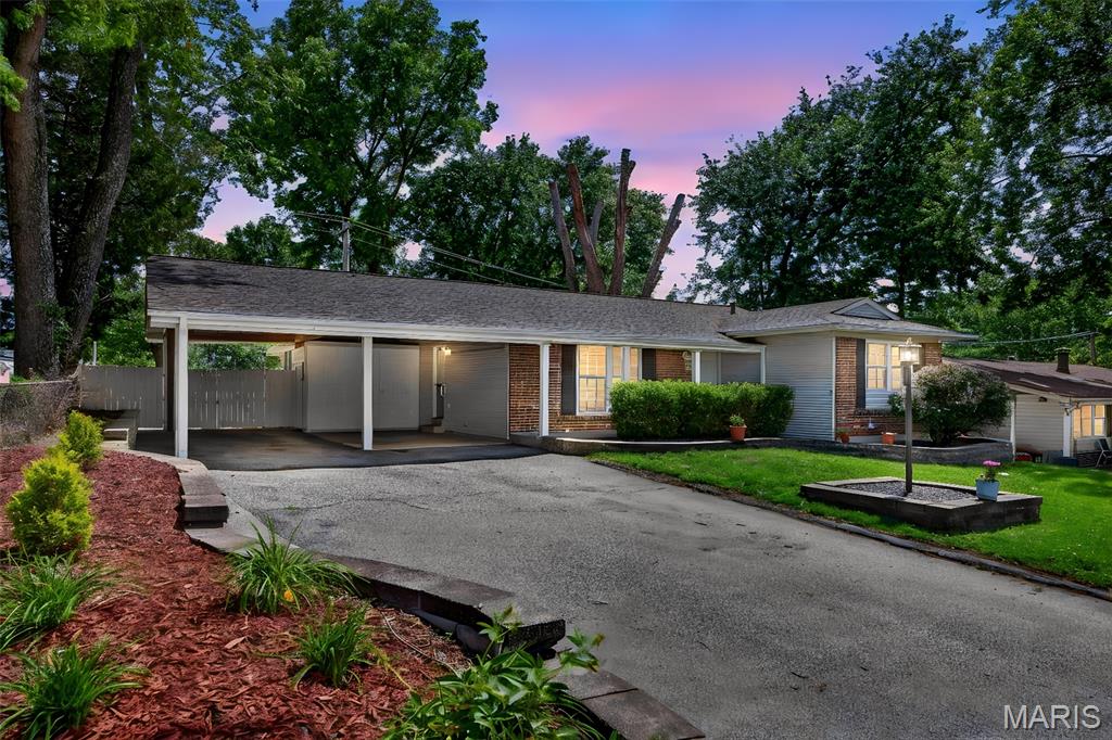 Welcome home to Quality Lane in the award-winning Parkway School District! This adorable 3-bedroom, 2-bath ranch has all the updates you need to move right in: gleaming hardwood floors, ceramic tile in the kitchen and baths, updated cabinets, stainless steel appliances, granite counters and a tile backsplash — rare at this price. The tidy, dry walkout basement includes a dedicated tool room and a handyman workshop. Outside you'll find an oversized 2-car carport with exterior storage units on a great lot. Newer upgrades in the recent years include water heater, HVAC, sewer lateral, retaining walls, patio, fence and more. Great neighborhood, centrally located with easy access to restaurants, shopping and West Port nightlife — updates and convenience at a great price. Don’t wait — this one will be gone on Monday! Additional room: Sun Room.