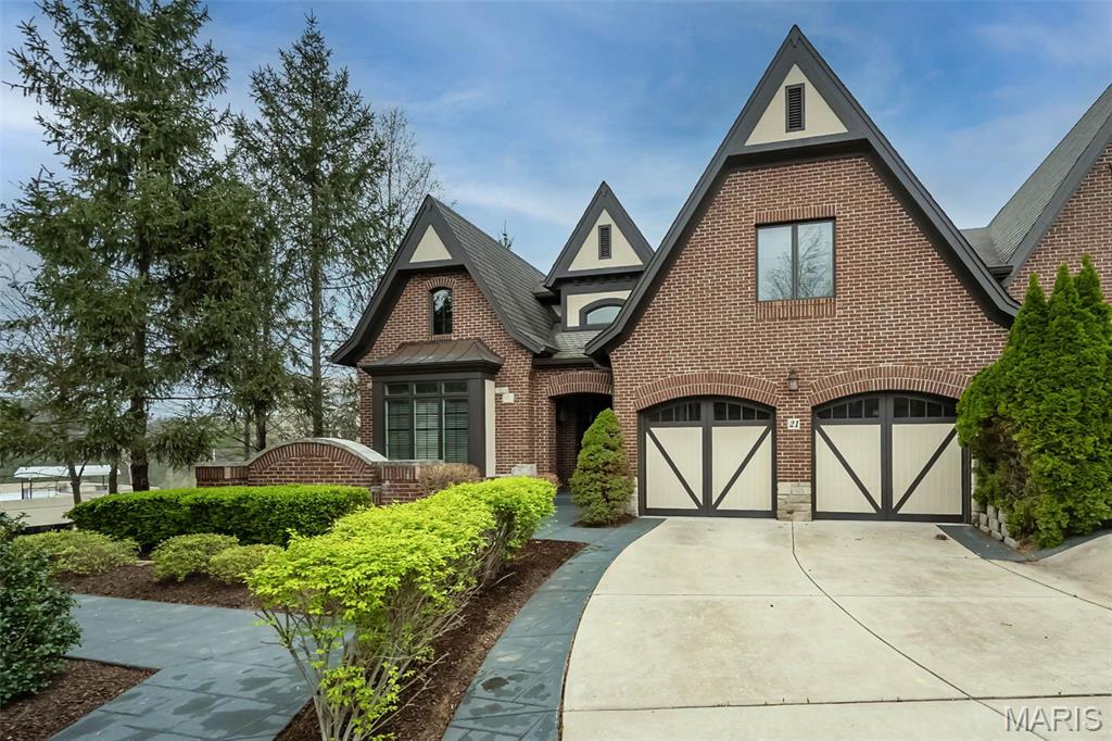 Welcome to the gated community of August Hill! Approximately 5,217 square feet of well-appointed living space awaits in this stately, 4 bedroom, 4.5 bathroom home. Hardwood flooring at the foyer, seamlessly flowing  from the dining room, through the kitchen to the elegant great room and stately office. The primary suite on the main floor features a luxury bath, custom closets, offering a tranquil retreat. Upstairs, a loft, 2 en-suite bedrooms with walk-in closets provide additional privacy and comfort. Meticulous attention to detail is evident in the extensive millwork, 9- and 12-foot ceilings, architectural windows and ceilings. The gourmet kitchen is equipped with SubZero refrigerator, Thermador gas cooktop, and convection double oven, & a Thermador warming drawer, catering to the most discerning chef. The lower level affords large rec room w/ stone FPL, full windows provide ample light, wet bar, 4th bedrm & full bath.You will love this carefree Hayden built home!