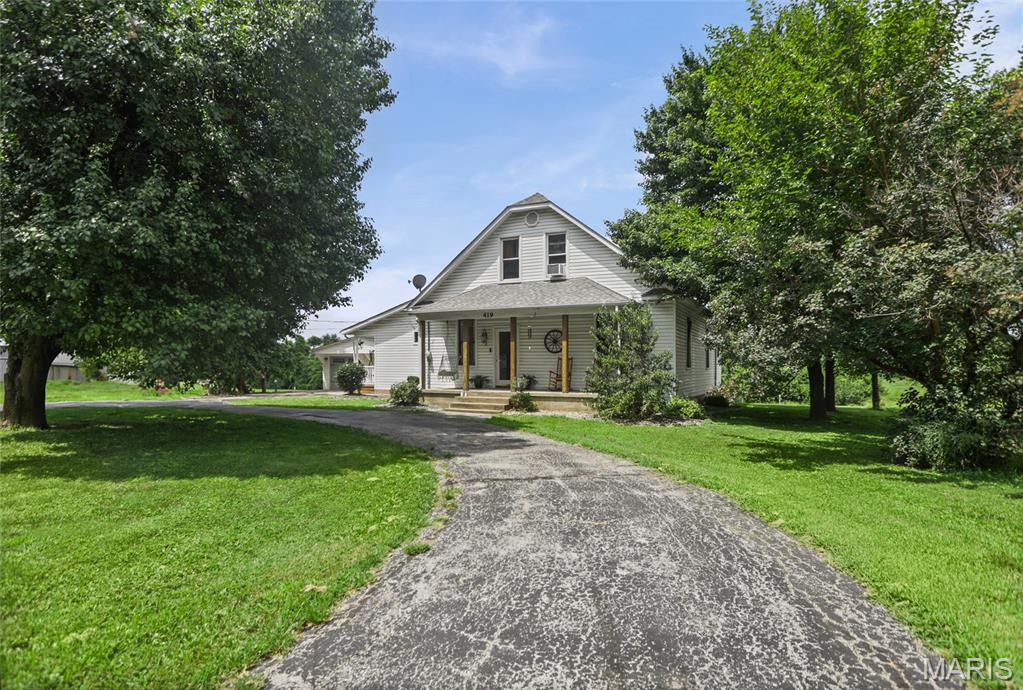 This is the perfect opportunity to own this 1.5 acre property on the outskirts of town.  You can enjoy 4-wheeling, biking, nature and country living.  The main home has a large eat-in kitchen, three bedrooms on the main level, 2 bedrooms up and a bedroom on the lower level with an egress window.  The kitchen opens up to a large-enclosed entertainment room with garage doors that open to the yard, deck and pool.  This is definitely the place to be on a hot summer day with steaks on the grill and cold refreshments in the cooler.  The property has a two car garage just off the side deck and additional parking in the drive-way and the circle drive.  But, that's not it!  When your family comes to visit or the college kid comes home for the summer, there is a large visitor's loft apartment above the outbuilding; open concept designed and equipped with a kitchenette and bathroom.  The loft apartment has been recently updated for comfort and convenience.  On the main level of the outbuilding, you will find room for parking, storage, a hobby room or man-cave.  This property has so much to offer!  You must come see for yourself!  Call your favorite agent today for a private tour.