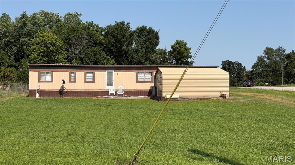 Move-In Ready 3-Bedroom Home with two garages/shop buildings — No HOA & No Restrictions! This 924 sq. ft. home offers 3 bedrooms and 1½ baths and is move-in ready. Located in the Fairdealing area within the Naylor School District, this .60-acre property is conveniently located near the Current River, making it an excellent opportunity for those who enjoy boating, fishing, camping, and outdoor recreation. The property offers plenty of room for boat storage and potential RV pads.
Chain-link fencing is already installed on two sides, with additional fencing available that needs to be installed. Two detached garages/shops provide excellent storage and workspace. The garage behind the home has power, water, and septic roughed in. With no HOA and no restrictions, there is flexibility to make the property work for your needs. Whether you're looking for a primary residence, weekend getaway, recreational property, or investment, this property offers plenty of possibilities in a desirable Southeast Missouri location.