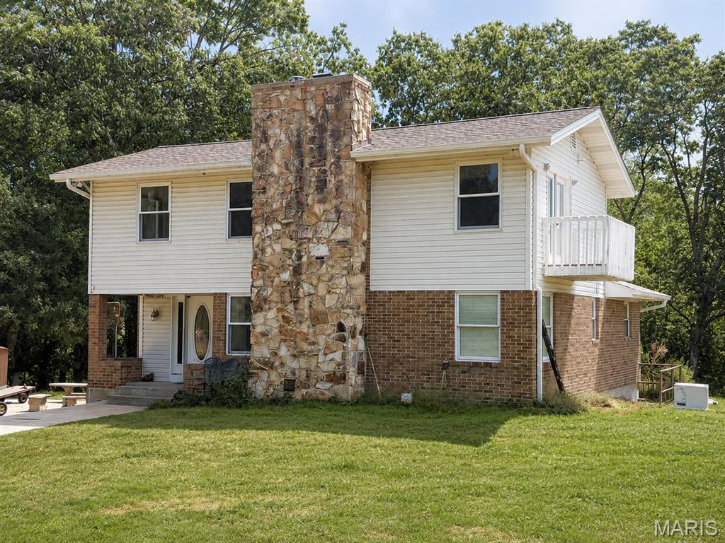 Park-like privacy on 8.29 acres! Surrounded by mature trees and wooded views, this spacious two-story home offers 2,834 square feet of living space, 3 bedrooms, and 2 full bathrooms. The oversized second-floor primary suite features a private full bath, walk-in closet, fireplace, and generous space to make it your own retreat.

The main level offers plenty of room to gather, with a spacious living room, family room, and open kitchen featuring an eat-in area and pantry. Two fireplaces add warmth and character, with one located in the family room and another in the primary bedroom. A spiral staircase adds an interesting architectural touch between levels.

Additional features include central air, electric forced-air heating, an attic fan, well and septic, walk-out basement/crawl space with sump pump, and ample parking with a detached garage and additional carport. The property adjoins a wooded area and offers the privacy and space that make acreage so appealing. If you're looking for a home where you can spread out, enjoy the outdoors, and have some breathing room from the neighbors, this one is worth a look!