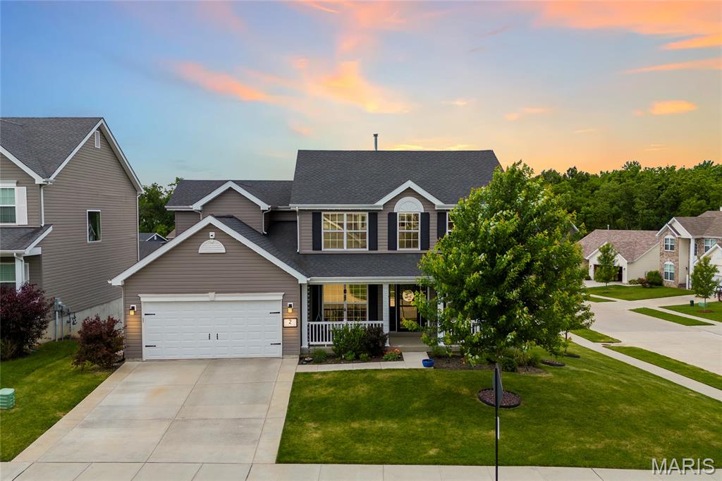 Welcome to 2 Windrush Ct in O’Fallon, featuring McBride’s popular Hermitage II floor plan with thoughtful upgrades and a functional layout designed for everyday living. The entry is framed by a dedicated dining room and private office with French doors, both accented with modern molding for a polished first impression. LVP flooring runs throughout the main level, adding a clean, cohesive feel and easy maintenance. The spacious kitchen offers ample cabinetry, a large center island, walk in pantry, and a customized beverage station with open shelving and beverage fridge, making it easy to gather, host, and stay organized. The living room is filled with natural light from three large windows, creating a comfortable and inviting main living space. Upstairs, a large picture window brightens the second level, where you’ll find four spacious bedrooms, including a generous primary suite with a large walk-in closet and luxury bath featuring a soaking tub, staggered vanity, and separate shower. Main floor laundry adds convenience, while the unfinished walk out basement offers room to grow and includes a built-in dog crate with a water line for the dog bowl. A beautiful blend of style, comfort, and practical details in a desirable O’Fallon location.