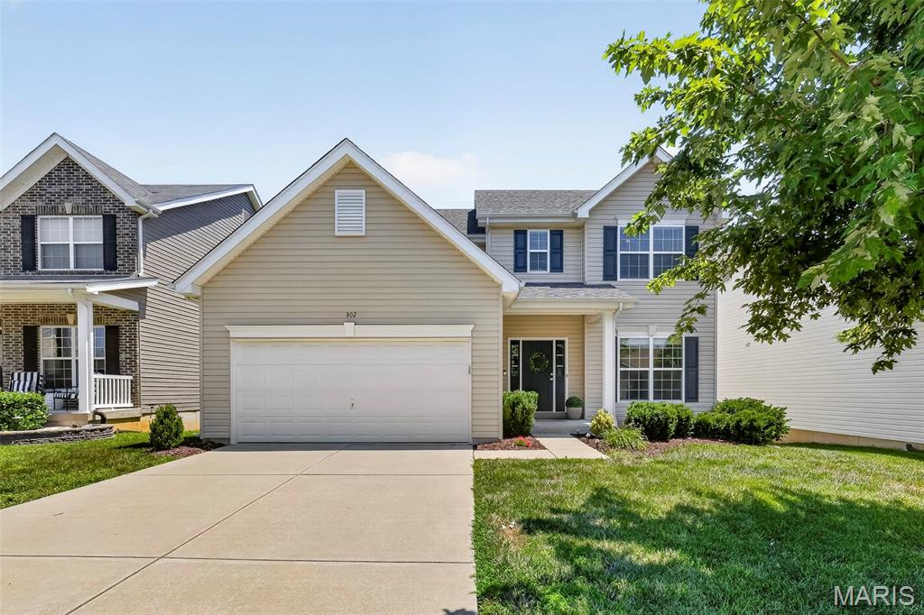 Welcome home to this beautifully updated 2-story home in the heart of Wentzville offering over 2,500 square feet of move-in ready living space! Featuring 4 bedrooms, 2.5 bathrooms, fresh paint, and new flooring throughout the main level, this home truly feels like new. A new roof was installed last year, and the deck has been freshly stained with new spindles, creating the perfect outdoor space to enjoy the peaceful common ground views.

Step inside to find a versatile flex room off the entry—ideal for a home office, playroom, formal living room, or whatever best fits your lifestyle. The light-filled family room features plush new carpet, an open spindle staircase, and an abundance of windows that flood the home with natural light.

The open-concept living room, breakfast room, and kitchen provide the perfect layout for everyday living and entertaining. The kitchen boasts hardwood floors, espresso cabinetry, stainless steel appliances, a center island, recessed lighting, and a corner sink overlooking the backyard. A separate dining room offers additional space for hosting family dinners and holiday gatherings. Just off the kitchen, you'll find a convenient main-floor laundry room, a half bath, and a sliding glass door leading to the freshly updated deck overlooking a large common area.

Upstairs, you'll find four spacious bedrooms, including a generously sized primary suite with a vaulted ceiling, oversized walk-in closet, and an expansive ensuite bath featuring dual sinks, a dedicated makeup vanity, a soaking tub, and a separate shower with built-in bench. Three additional bedrooms all offer fresh paint, carpet, and walk-in closets, while the shared full bath includes a double vanity and tub/shower combination.

The walk-out lower level is ready for your finishing touches and includes a rough-in for a future full bathroom, ample storage space, and endless possibilities for additional living space.

Located in a desirable Wentzville neighborhood, this immaculate home combines space, style, and thoughtful updates with a beautiful backdrop of common ground. All that's left to do is move in and enjoy!