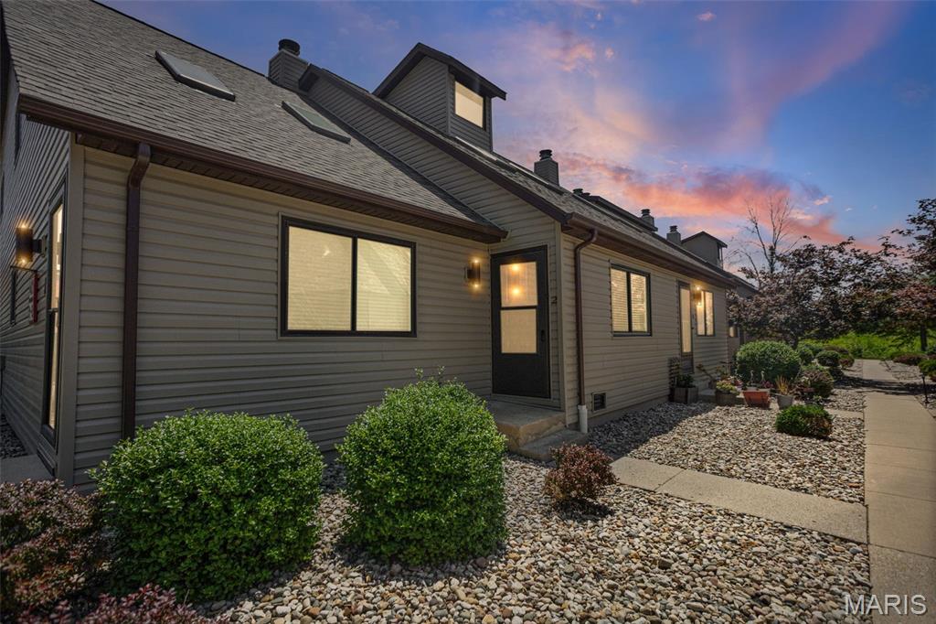 Check out this move in ready 2 bedroom, 2 bath condo in O'Fallon! Enjoy the low maintenance lifestyle! Includes 1-car detached garage. Private backyard is fenced with patio space & includes storage shed. Main level features a living room with vaulted ceiling & skylights! Open floor plan with eat-in kitchen, appliances included. Bedroom 1 is on the main level, includes double closets & there is a half bath with laundry area. Upper level includes a loft with fireplace & built in shelving, full bath & 2nd bedroom. New HVAC system 2026! Ground level, middle unit. Buyer to verify all information.