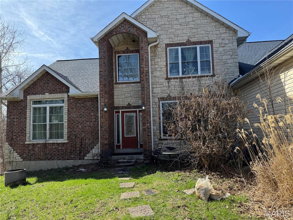 Investment Opportunity on 3+ Acres in Labadie!
Custom 1.5-story home situated on approximately 3 acres in Eastern Franklin County. The property offers a peaceful country setting with a fenced yard, chicken coop, and oversized 3-car side-entry garage. The home features approximately 2,896 square feet with 4 bedrooms, 2 full baths, and 1 half bath. Main level includes a primary suite, kitchen with center island and pantry, living room with vaulted ceiling and large windows, dining room, laundry room, and half bath. Upper level offers 3 additional bedrooms, a full bath, and a loft/family room overlooking the living area. Walk-out lower level is unfinished. Property is in need of repairs, updates, and deferred maintenance and may not qualify for all financing types. Being sold strictly AS IS. Seller will make no repairs or inspections. Potential short sale subject to lender approval. Conveniently located in the Washington School District with easy access to Highway 100 and nearby shopping, dining, and amenities. This property may be best suited for  investors, rehab buyers, or purchasers looking for an opportunity to build equity.