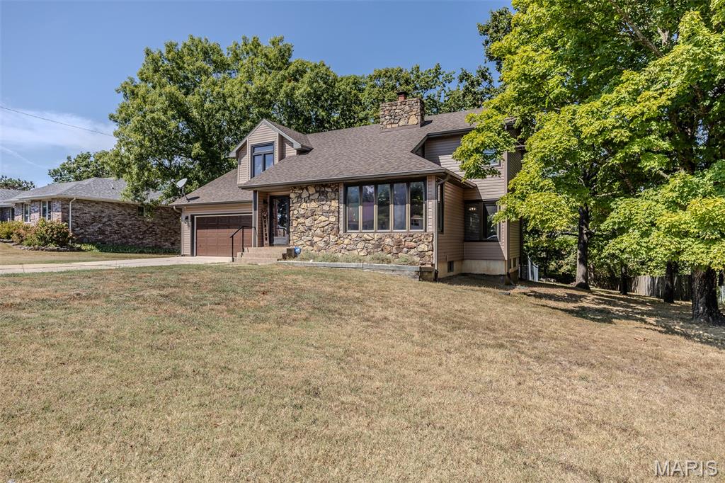This home has been beautifully remodeled and has a full unfinished basement with so much potential. Beautiful stone fireplace in the large living room with vaulted ceilings and plenty of windows for natural light including a beautiful stained glass window. The large master suite upstairs has large windows with a window seat perfect for reading, a walk-in closet and a full bathroom. There is an extra room upstairs that could be an additional bedroom or second area to relax and watch Tv, read or would make a great playroom. Relax on the back deck overlooking the large, flat backyard with mature trees and enjoy a BBQ or morning coffee. This home features a new roof, siding, gutters, gutter guards, paint, flooring and much more.  Additional rooms for storage, work out area, hobby area or whatever you desire could be made in the unfinished basement. This home could easily be 3++ bedrooms. Located in a great neighborhood, conveniently located near schools, shopping, downtown and the 103 exit with access to I-44.