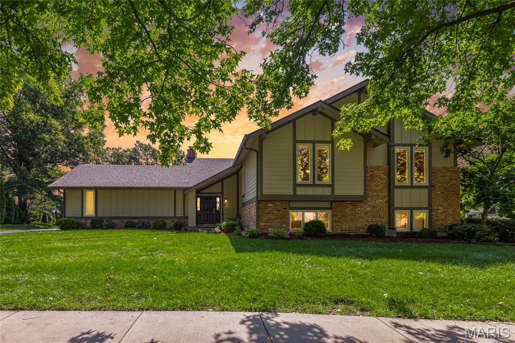 Tucked away on a picturesque cul-de-sac in the highly sought-after Scarborough subdivision, this exceptional residence combines timeless elegance with modern updates in the award-winning Parkway School District. Rich hardwood flooring flows throughout the main living areas, creating a warm and sophisticated backdrop for everyday living and entertaining.

The beautifully renovated kitchen serves as the heart of the home, showcasing crisp white custom cabinetry, stunning matte granite countertops, stainless steel appliances, double wall ovens, a microwave drawer, gas cooktop, recessed lighting, and a sunlit breakfast area with seamless access to the expansive rear deck. The formal dining room is enhanced by a custom bowed window framing serene backyard views, while the adjoining family room features oversized windows that flood the space with natural light and bring the outdoors in.

The main level offers three generously sized bedrooms, including a luxurious primary retreat with a beautifully updated spa-inspired bath. An updated hall bath and new carpeting throughout all bedrooms (2026) further elevate the home's appeal.

Designed for both relaxation and entertaining, the finished walk-out lower level offers an impressive extension of living space. Highlights include a spacious second family room with fireplace and recessed lighting, two additional bedrooms, and a full bath—ideal for guests, extended family, or private work-from-home accommodations. Surrounded by mature landscaping and situated in one of Chesterfield's most desirable neighborhoods, this residence offers the perfect blend of comfort, sophistication, and location.